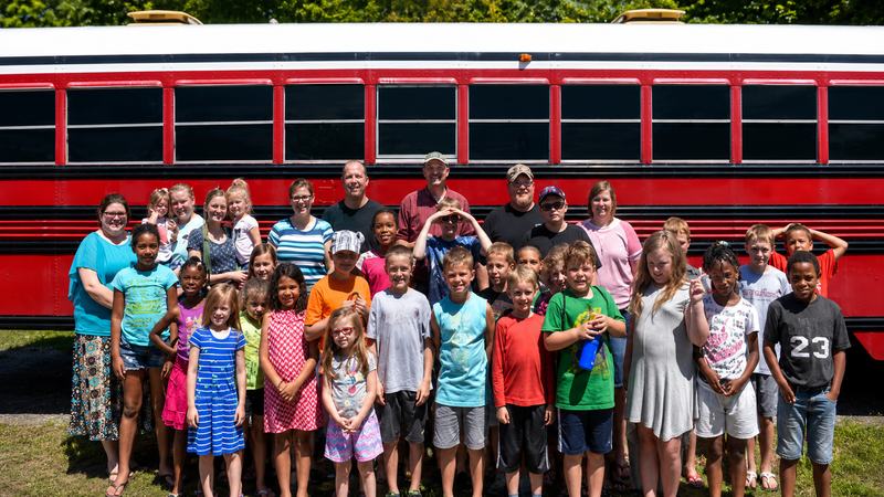 Children by the Calvary Road Baptist Church bus