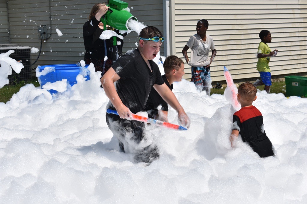 Children playing in the foam at Tidal Wave Sunday