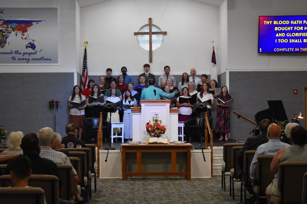 The sanctuary at Calvary Road Baptist Church during a service, with the choir singing